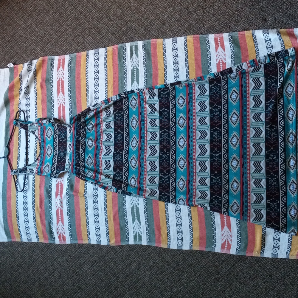 A tribal pattern dress that's red, turquoise, black and white. It's a medium.